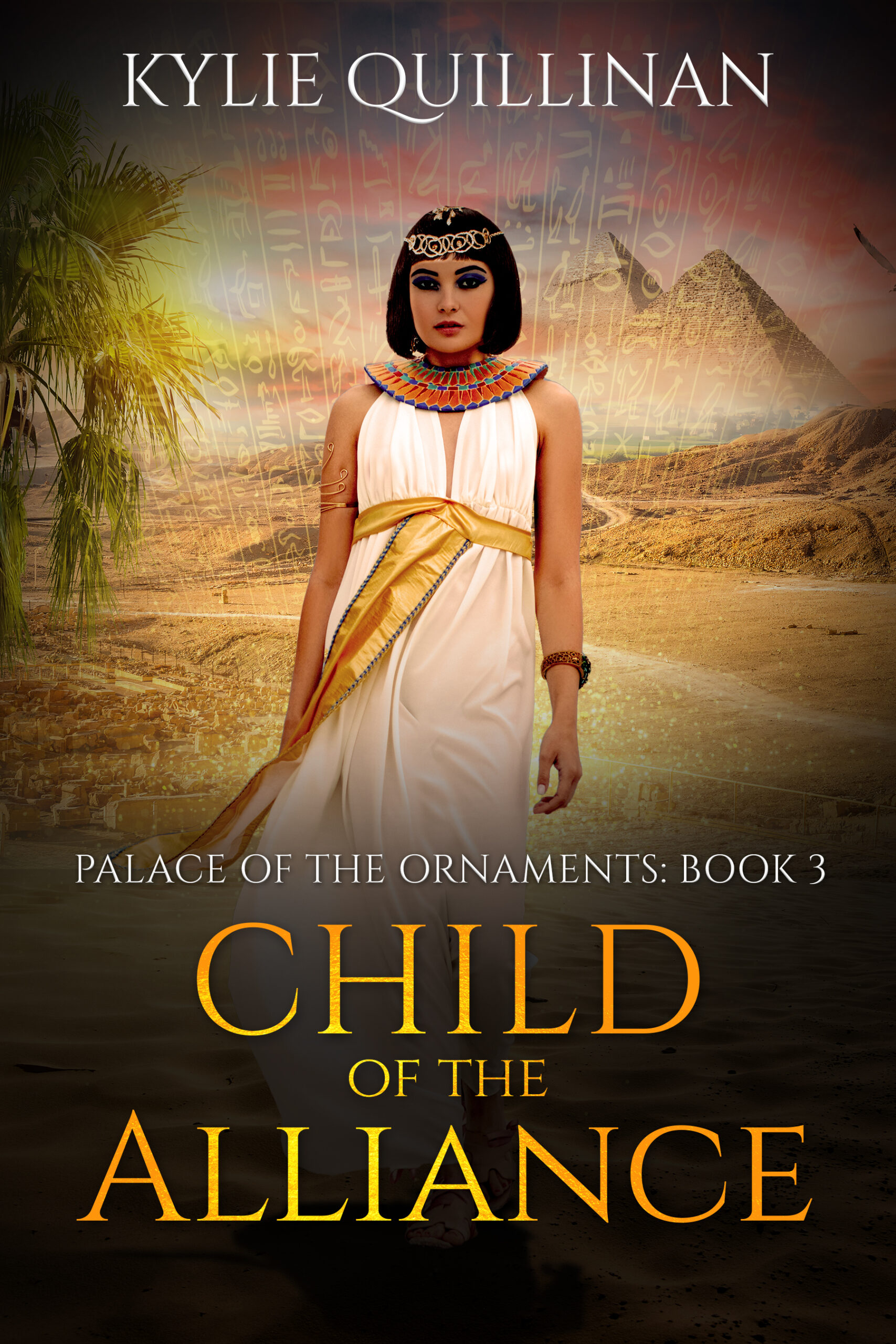 A woman wearing a white gown with a golden sash stands in front of pyramids and a desert track.