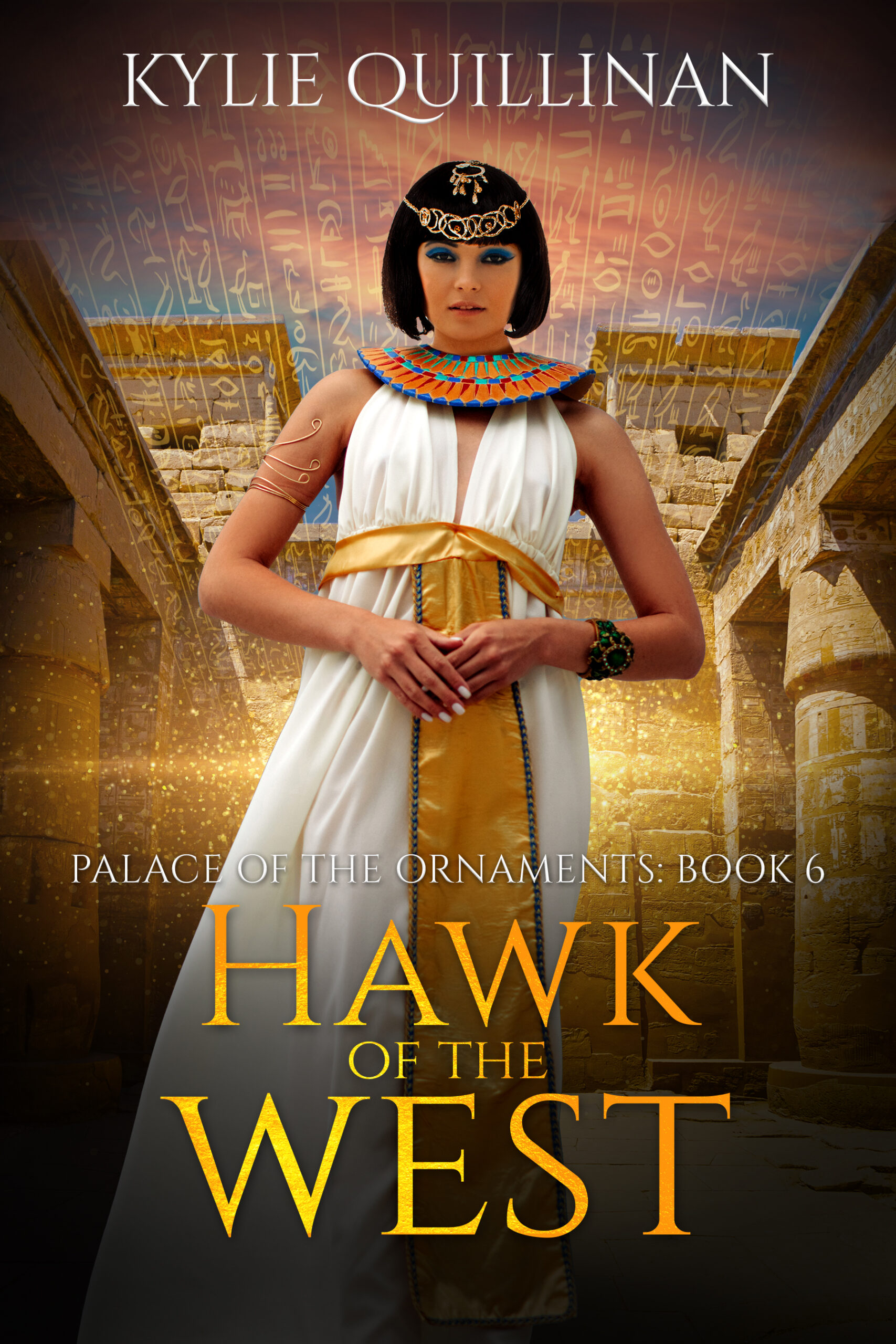 A woman wearing a white gown with a golden sash stands in the courtyard of a temple.
