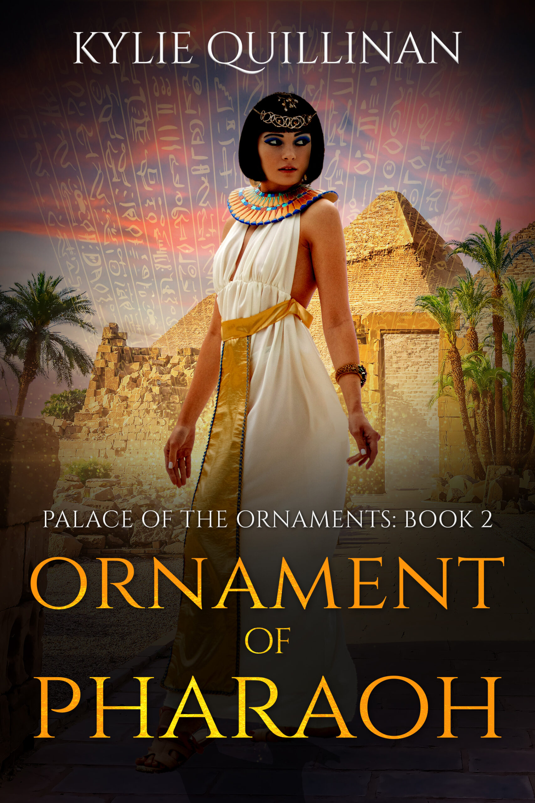 A woman wearing a white dress with a golden sash stands in front of a pyramid.